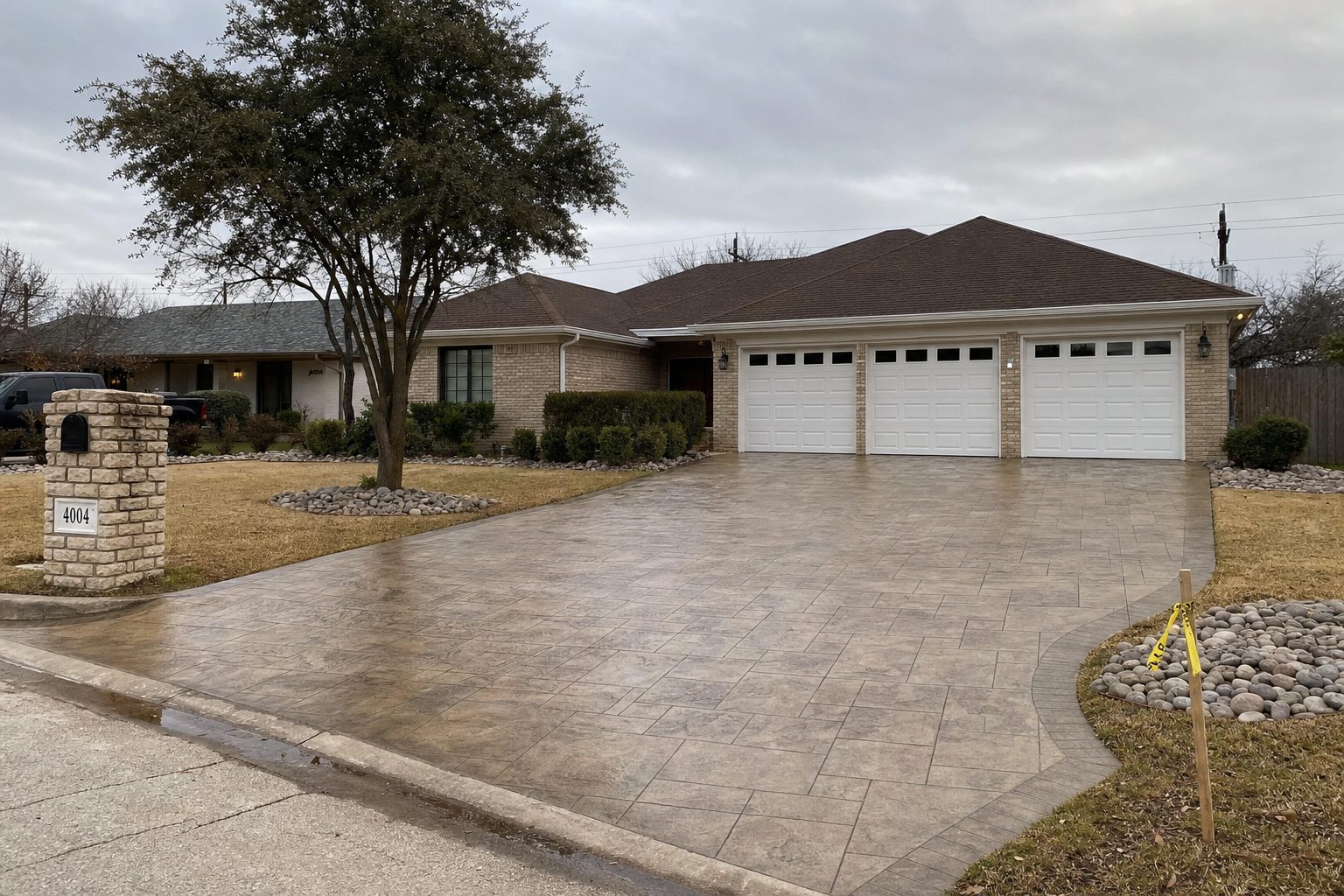 Stamped concrete driveway with decorative banding