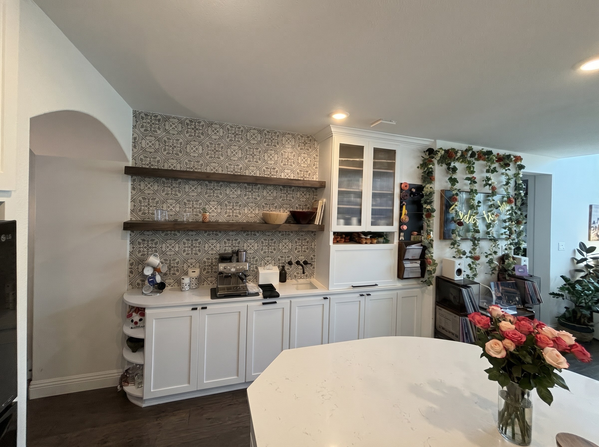 Built-in coffee bar with patterned tile backsplash